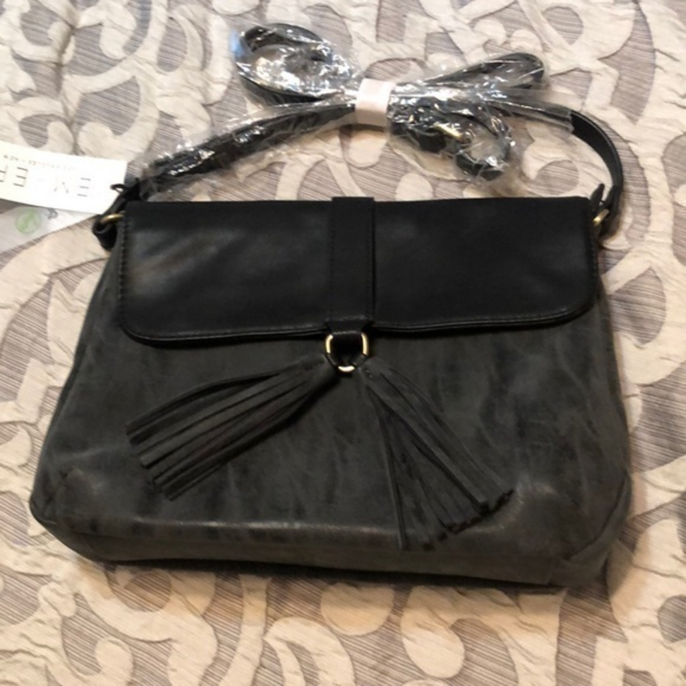 Distressed vegan leather New with tags from Nordstrom large tassels on the front